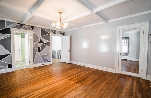 unfurnished room with baseboards, a notable chandelier, coffered ceiling, beamed ceiling, and hardwood / wood-style flooring