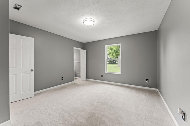 3667 Randee Ln, Springfield, OH 45502 - unfurnished bedroom featuring carpet flooring and a textured ceiling