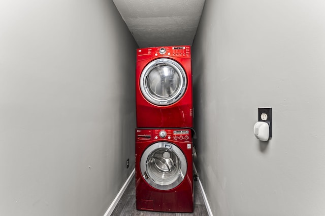 3667 Randee Ln, Springfield, OH 45502 - washroom featuring stacked washer and clothes dryer and wood finished floors