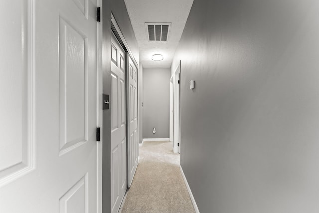 3667 Randee Ln, Springfield, OH 45502 - corridor with a textured ceiling and light colored carpet