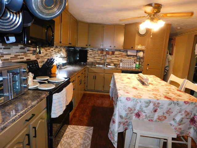 kitchen with tasteful backsplash, a sink, black appliances, a ceiling fan, and dark wood-style flooring