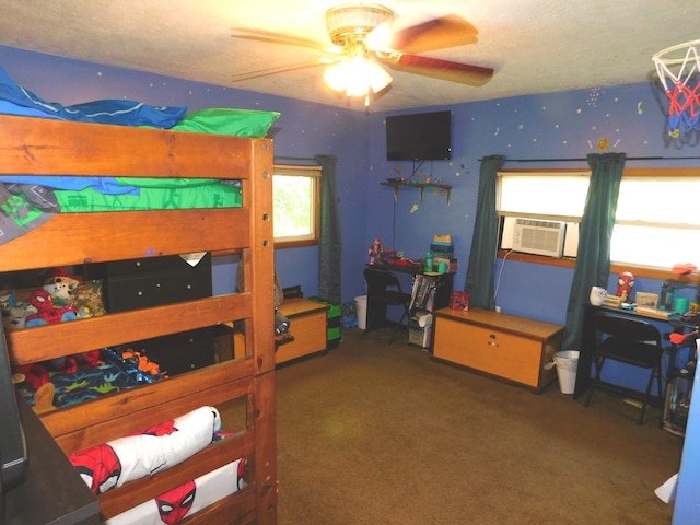 bedroom with carpet flooring, cooling unit, a textured ceiling, and ceiling fan