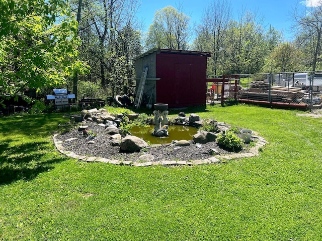 view of yard with a storage shed and an outdoor structure