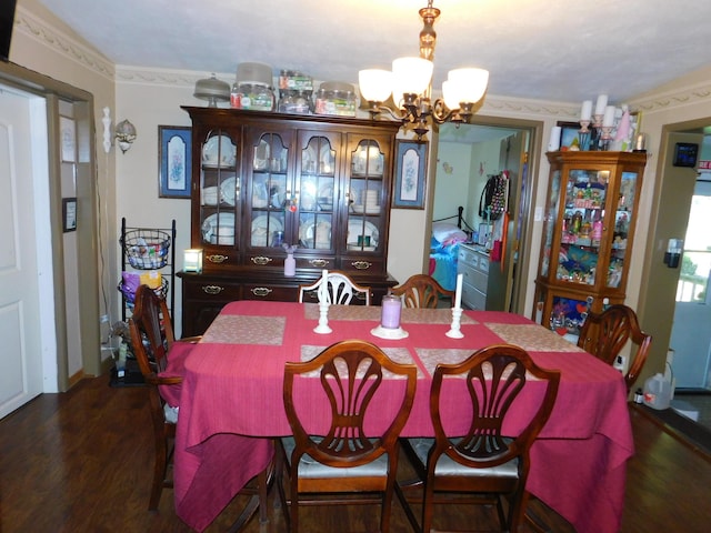 dining area featuring dark wood-type flooring and a notable chandelier