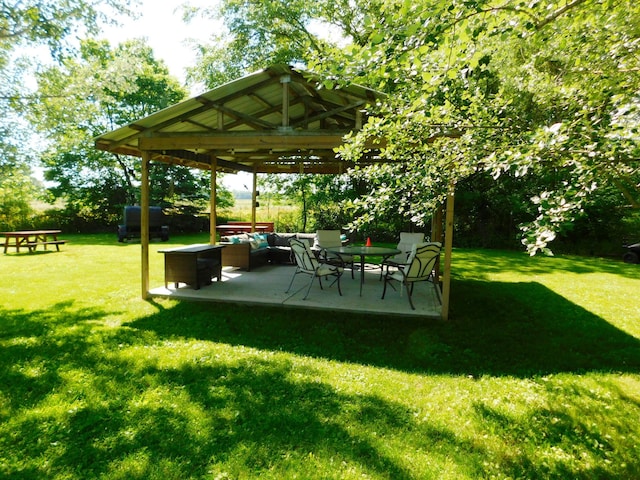 view of yard featuring a gazebo, a patio, and outdoor lounge area