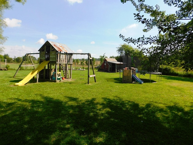 view of jungle gym featuring a lawn