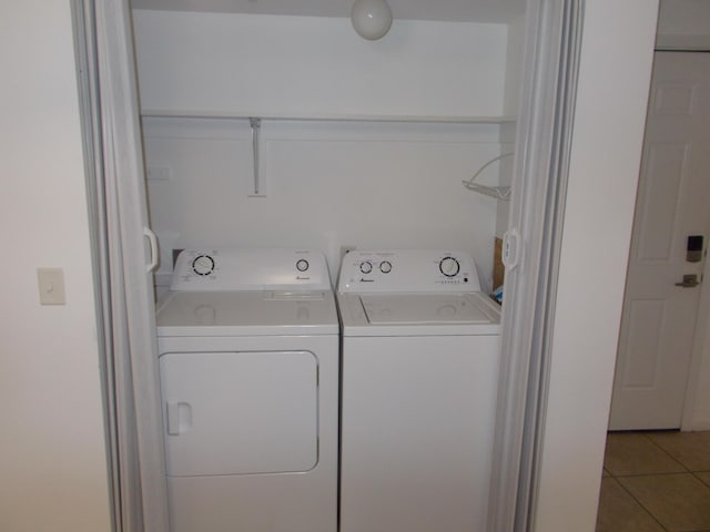 1145 W Bank Unit 106, Celina, OH 45822 - washroom featuring washing machine and dryer and light tile patterned flooring