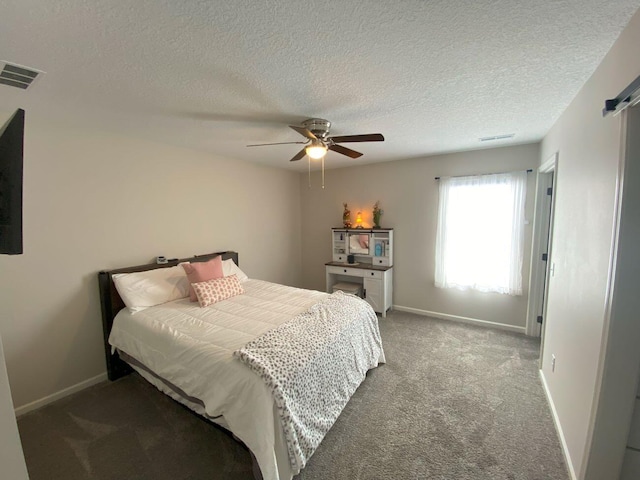 carpeted bedroom featuring baseboards, visible vents, and a ceiling fan