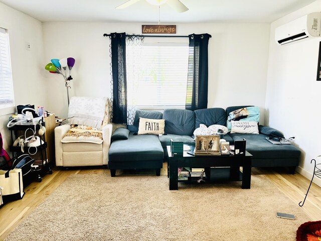 201 Clay St, Rockford, OH 45882 - living area featuring a wall mounted AC, ceiling fan, and wood finished floors