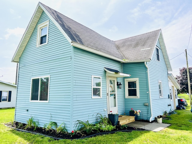 201 Clay St, Rockford, OH 45882 - rear view of property with a yard and roof with shingles