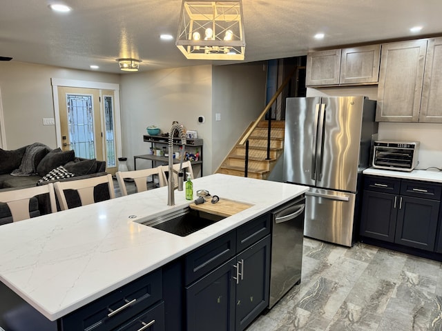 kitchen with marble finish floor, a center island with sink, stainless steel appliances, recessed lighting, and open floor plan