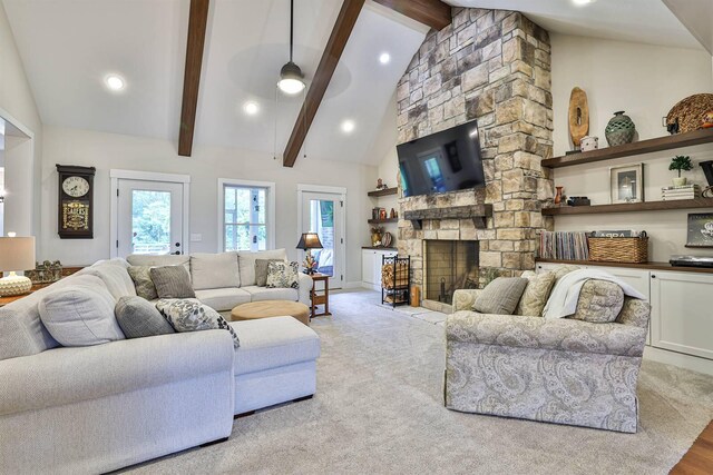 1439 Legacy Ct, Troy, OH 45373 - living room with beamed ceiling, high vaulted ceiling, recessed lighting, a stone fireplace, and carpet flooring
