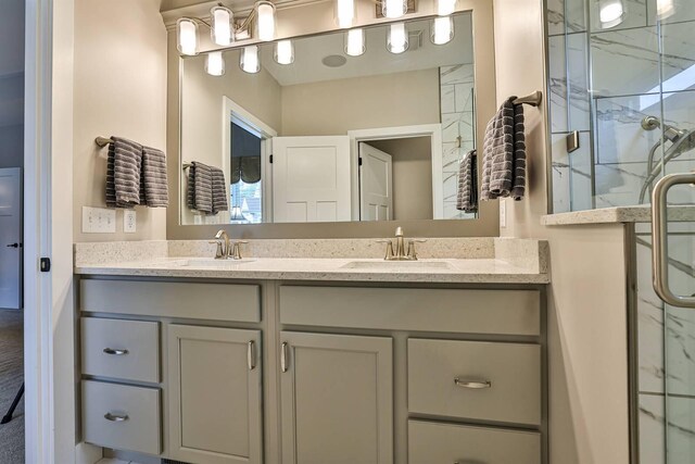 1439 Legacy Ct, Troy, OH 45373 - bathroom featuring double vanity and a marble finish shower