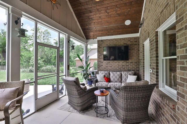 1439 Legacy Ct, Troy, OH 45373 - sunroom featuring an outdoor hangout area, vaulted ceiling, and healthy amount of natural light