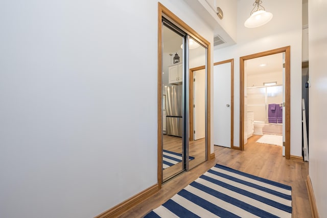 9342 State Route 368, Huntsville, OH 43324 - hallway featuring light wood-style floors and baseboards