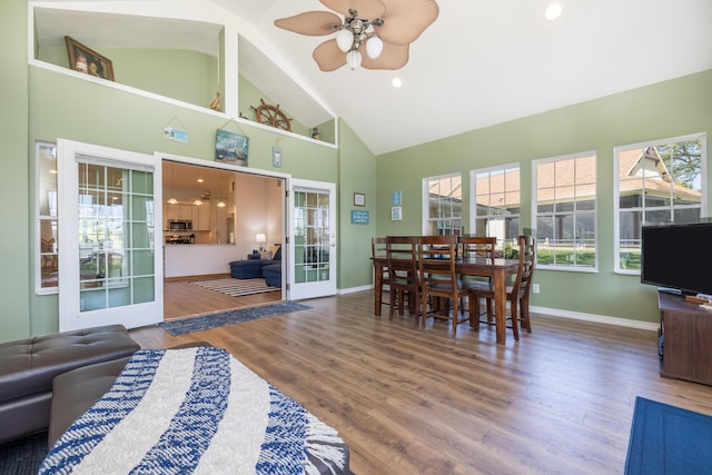 9342 State Route 368, Huntsville, OH 43324 - dining room featuring high vaulted ceiling, healthy amount of natural light, ceiling fan, baseboards, and wood finished floors
