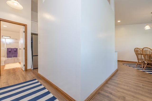 9342 State Route 368, Huntsville, OH 43324 - hallway featuring light wood-style floors, baseboards, and recessed lighting