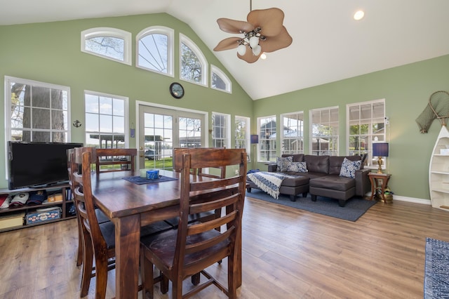 9342 State Route 368, Huntsville, OH 43324 - dining room with high vaulted ceiling, a ceiling fan, and wood finished floors