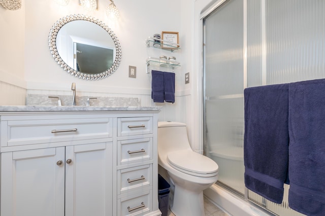 9342 State Route 368, Huntsville, OH 43324 - full bathroom with vanity, toilet, a shower with door, and tile patterned flooring