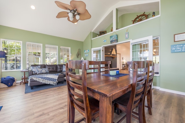 9342 State Route 368, Huntsville, OH 43324 - dining room with high vaulted ceiling, plenty of natural light, ceiling fan, wood finished floors, and baseboards