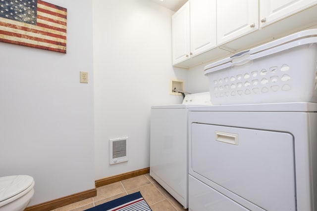 9342 State Route 368, Huntsville, OH 43324 - laundry room with washing machine and clothes dryer, heating unit, baseboards, and light tile patterned floors