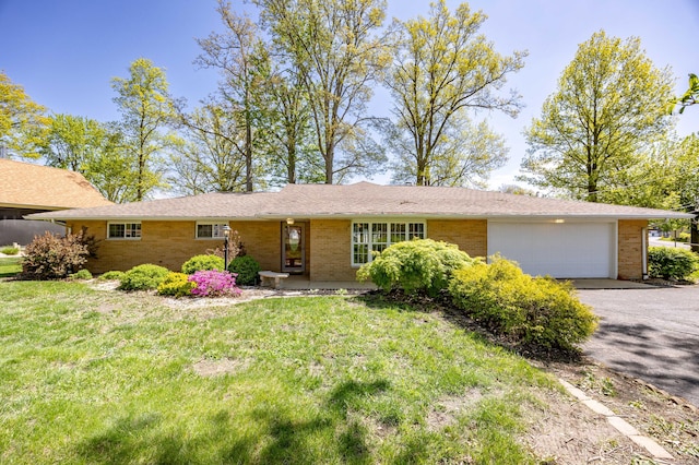 9342 State Route 368, Huntsville, OH 43324 - single story home with brick siding, a garage, a front yard, and driveway