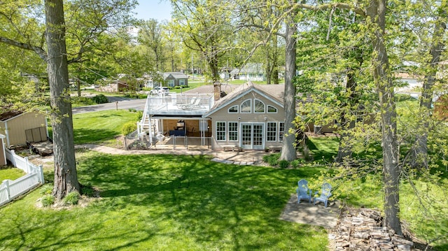 9342 State Route 368, Huntsville, OH 43324 - rear view of property with a deck, a patio area, stairs, an outbuilding, and french doors