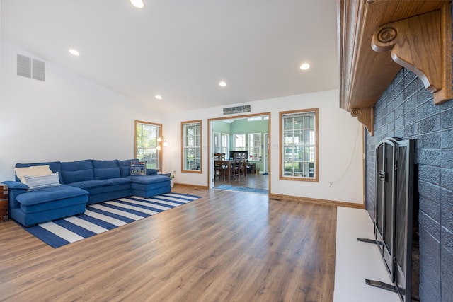 9342 State Route 368, Huntsville, OH 43324 - living room with a fireplace, wood finished floors, recessed lighting, baseboards, and lofted ceiling