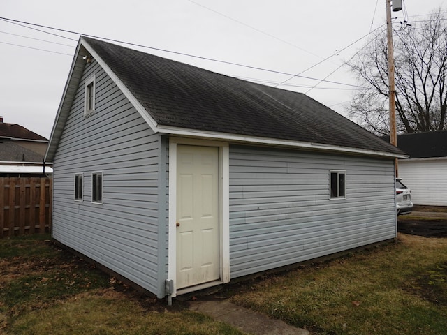 view of side of property featuring an outbuilding