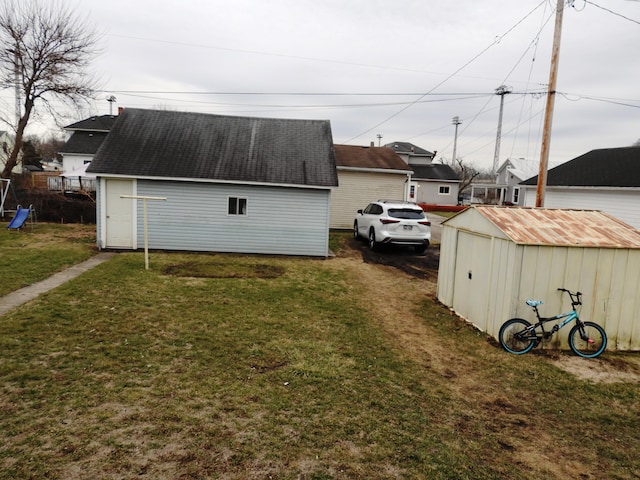 exterior space with a yard and an outdoor structure