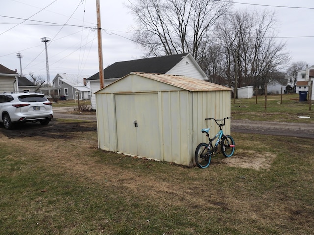 view of outbuilding featuring a yard