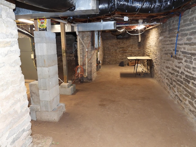 basement featuring heating unit