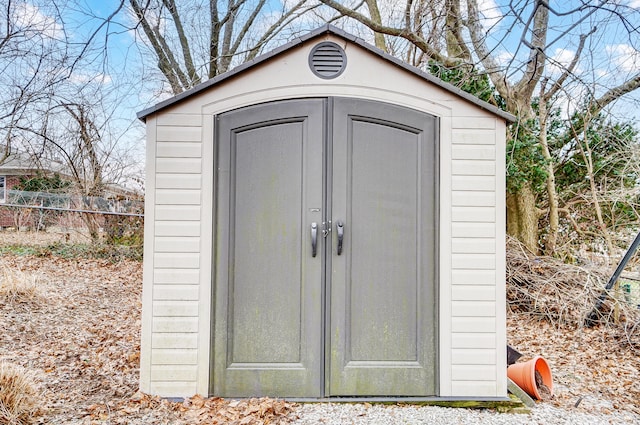 view of shed with fence