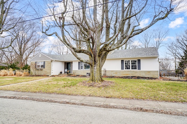 single story home with a front yard, stone siding, roof with shingles, and stucco siding