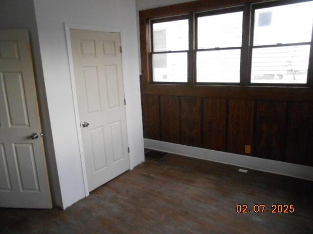 interior space featuring wood finished floors and a healthy amount of sunlight