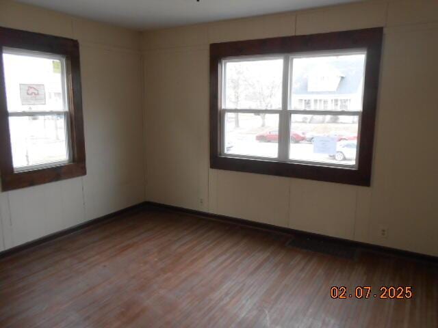 empty room featuring wood finished floors