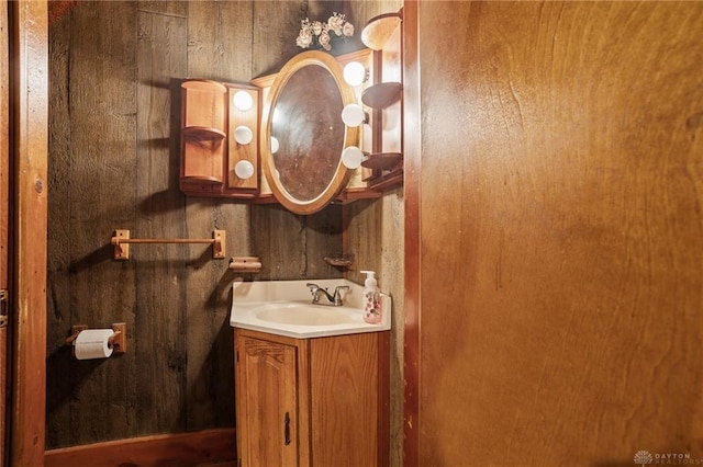 323 Miami St, Piqua, OH 45356 - bathroom featuring wood walls and vanity