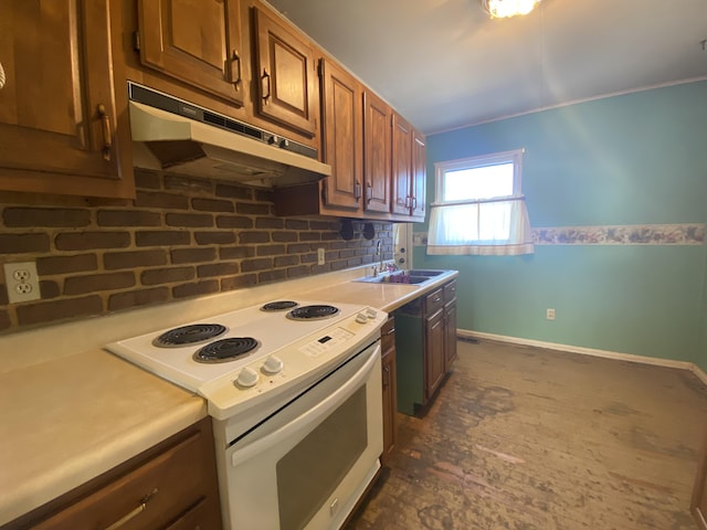 kitchen with white electric range oven, baseboards, light countertops, under cabinet range hood, and a sink