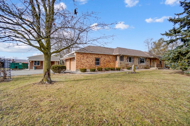 ranch-style home featuring a garage and a front lawn