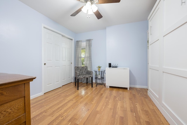 11177 Sassafrass Rd, Lakeview, OH 43331 - living area featuring a ceiling fan, light wood-style floors, and baseboards