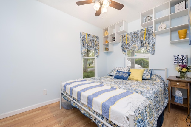 11177 Sassafrass Rd, Lakeview, OH 43331 - bedroom featuring wood finished floors, baseboards, and a ceiling fan