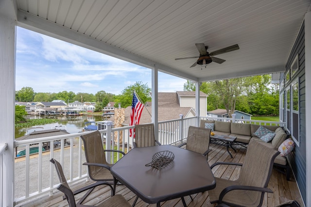 11177 Sassafrass Rd, Lakeview, OH 43331 - deck featuring a water view, outdoor lounge area, ceiling fan, outdoor dining area, and view of scattered trees