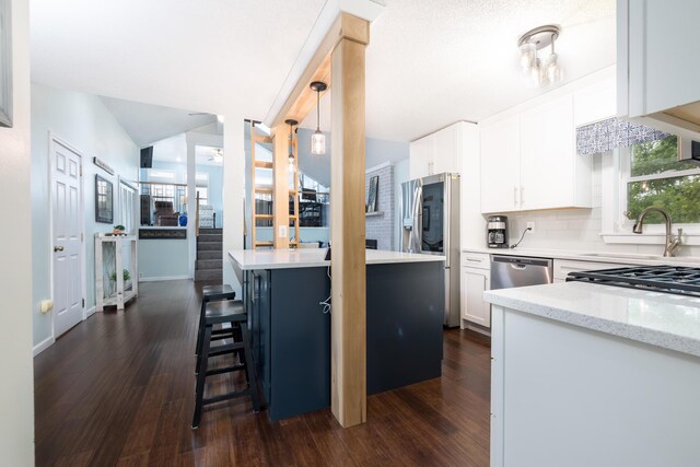11177 Sassafrass Rd, Lakeview, OH 43331 - kitchen featuring a sink, dark wood-style floors, white cabinets, and tasteful backsplash