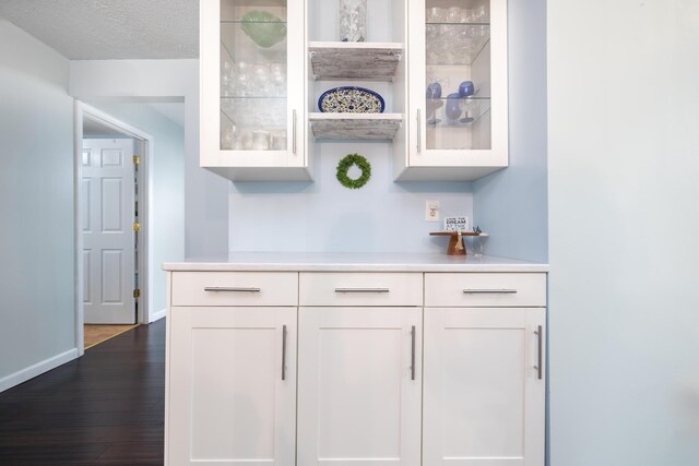 11177 Sassafrass Rd, Lakeview, OH 43331 - indoor dry bar featuring dark wood-style floors and baseboards