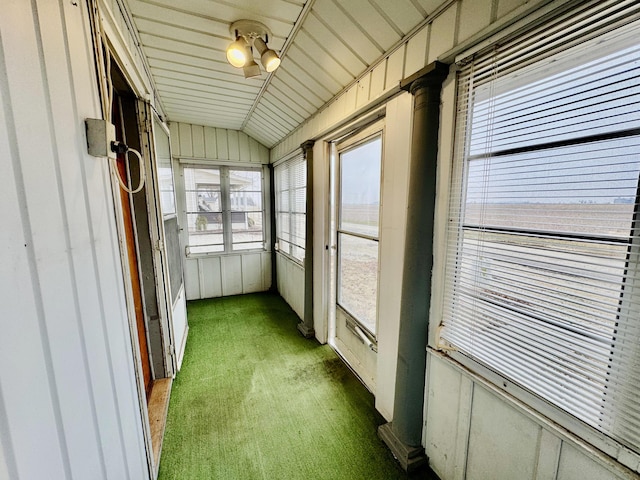 unfurnished sunroom with vaulted ceiling