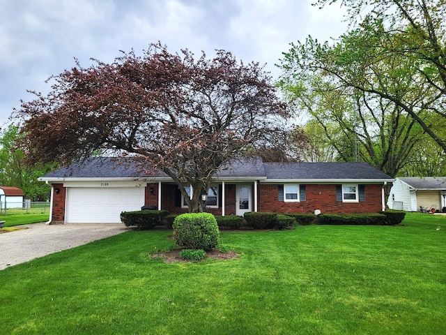 2169 State Route 49, Arcanum, OH 45304 - ranch-style home featuring brick siding, driveway, a front yard, and a garage