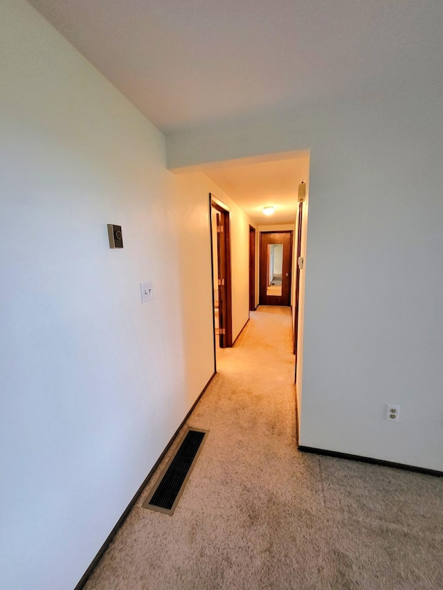 2169 State Route 49, Arcanum, OH 45304 - hall featuring baseboards, visible vents, and light carpet