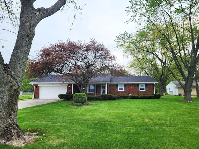 2169 State Route 49, Arcanum, OH 45304 - ranch-style house with brick siding, an attached garage, driveway, and a front yard