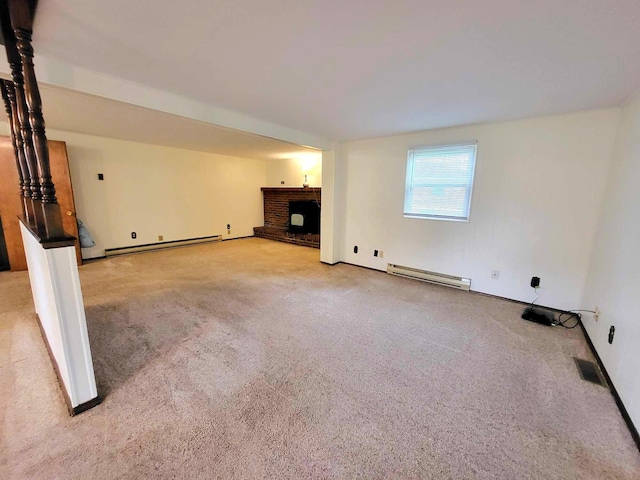 2169 State Route 49, Arcanum, OH 45304 - unfurnished living room with carpet flooring, a fireplace, baseboards, baseboard heating, and a baseboard radiator