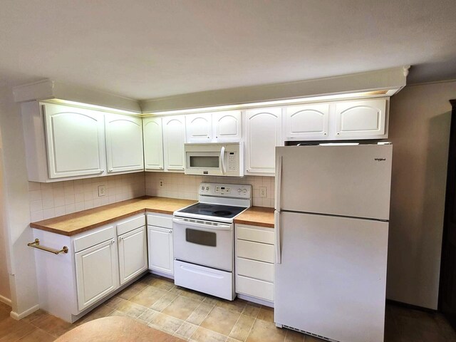 2169 State Route 49, Arcanum, OH 45304 - kitchen featuring butcher block countertops, decorative backsplash, white cabinetry, and white appliances